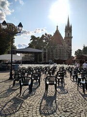 plastic chairs ready for a show near the Evangelical Church, Bistrita, Romania, 2021, August