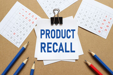 Product Recall, the text on the sticker near the calendar and karagdash. the paper is clamped with...