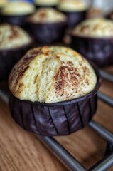Vanilla muffin with chocolate dust in small brown forms, home cooking