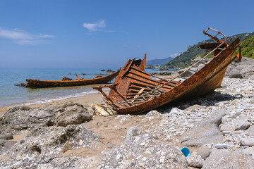 Remain of fishing boat in Agios Gordios resort village on west coast of Corfu Island, Greece