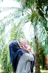 Obraz premium Beautiful asian mom and baby playing happiness in the park , outdoor ,mother day concept