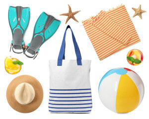 Set with towel and other beach accessories on white background © New Africa