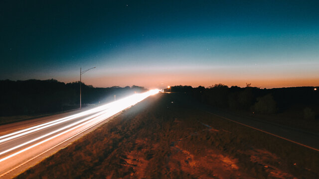 Night road lights. Lights of moving cars at night. long exposure multicolored. High quality photo