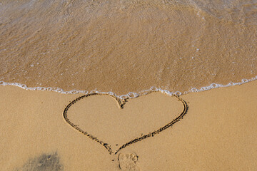 Heart on a sandy Apotripiti Beach in Sidari village, COrfu Island, Greece
