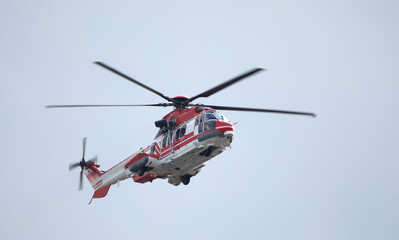 Fototapeta na wymiar Ambulance, military or civilian helicopter on sky background.