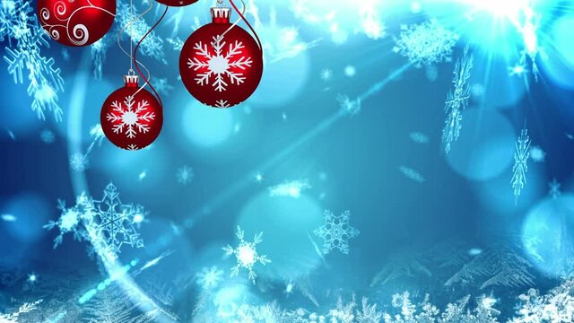 Animation of christmas boubles and snow falling over blue background with bokeh