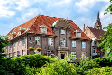 Landessparkasse Oldenburg in Jever with city church in background, Lower Saxony, Germany