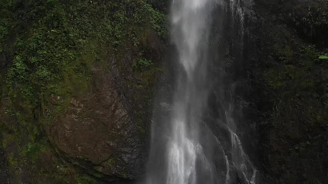 aerial view of a waterfall in the middle of trees