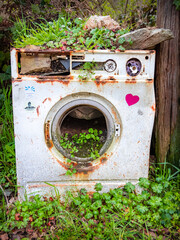 Old Washing Machine outside the Cafe Casa Polin in Las Herrerias along the Way of St James Pilgrimage Trail Camino de Santiago