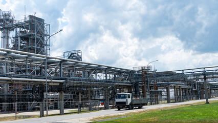 Industrial view at oil refinery plant form industry zone with cloudy sky. Industry concept.