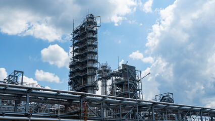 Industrial view at oil refinery plant form industry zone with cloudy sky. Industry concept.