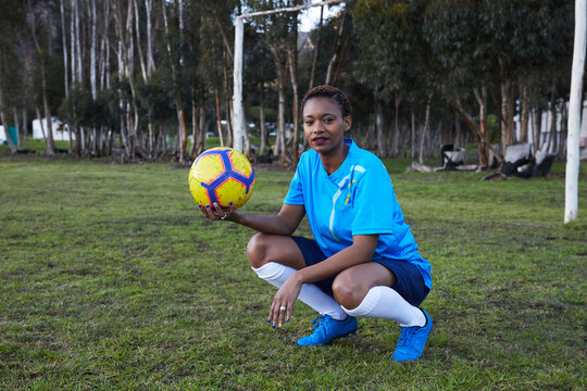 Black woman playing soccer
