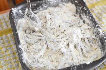 cooking some sardines flouring process