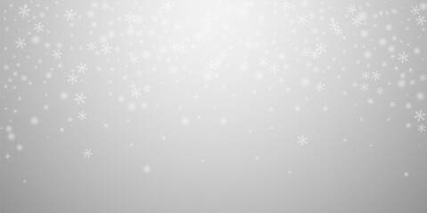 Sparse glowing snow Christmas background. Subtle f