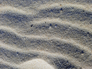 Wavy sandy beach background with strong shadow