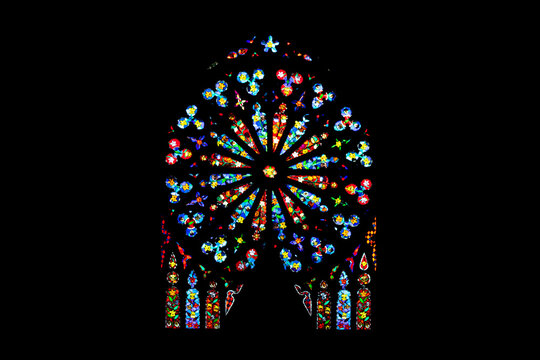 stained glass window in church rainbow colored design mandala