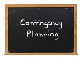 Contingency Planning written in white chalk on a black chalkboard isolated on white