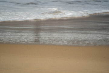 waves on the sand at the beach