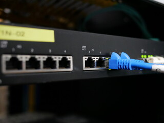 LAN cable network connected to internet switch servers in data center.
