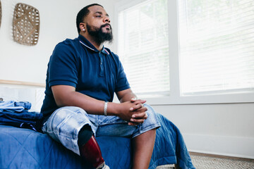 Black man, deep thought, reflection, inner peace