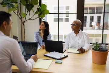 Multiethnic group listening to speaker