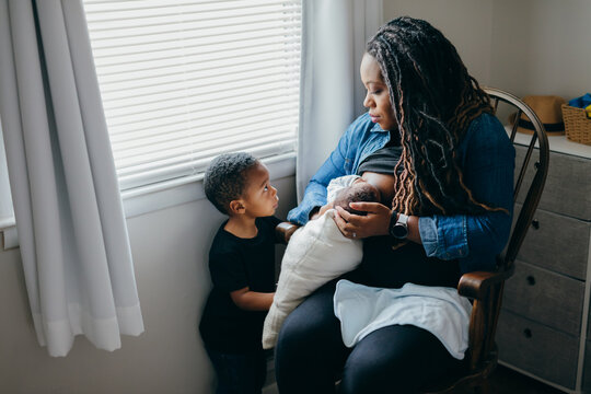 African American mother breastfeeding baby