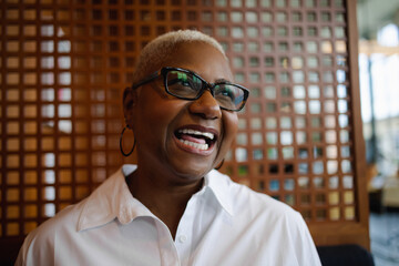 Portrait of senior Black woman, business, visionary, happy and smiling with copy-space