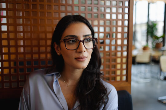 Portrait of adult Middle Eastern woman, business, visionary with copy-space 