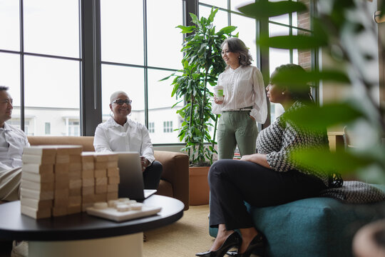 Diverse Business team meets in office, Mature Asian woman leadership 