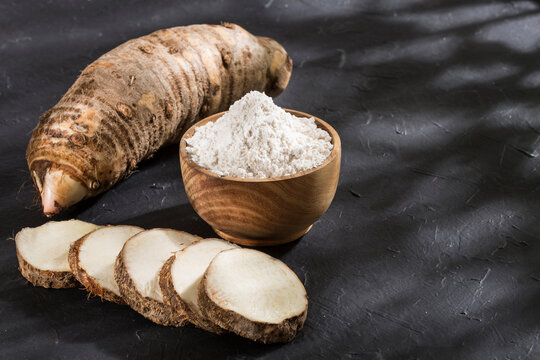 Taro Root of Colocasia esculenta and Organic Taro Flour in a bowl