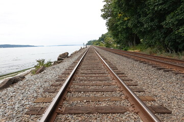 Fototapeta premium railway track, line crossing railway track on the stone background in WA, USA.