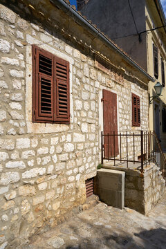 historical house from traditional limestone in the old town of Krk in Croatia