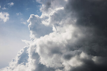 Cumulonimbus clouds on a clear sunny summer day.