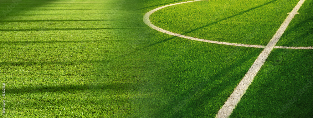 Wall mural green grass of football field with white curve line sport competition banner background