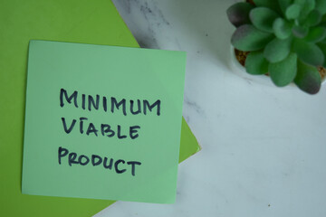 Minimum Viable Product write on a paperwork isolated on Wooden Table.