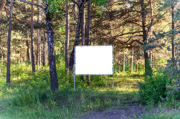 Mock up for design, billboards along the road against the background of the forest.