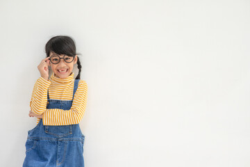 Portrait of funny smiling little girl child wearing glasses