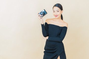 Portrait beautiful young asian woman use camera