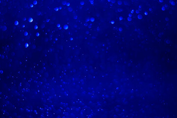 Blue glitter vintage lights background.