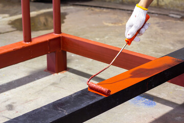 Rust-proof painted steel pipes in the factory. Red iron pipe. Rust-proof paint, water pipes