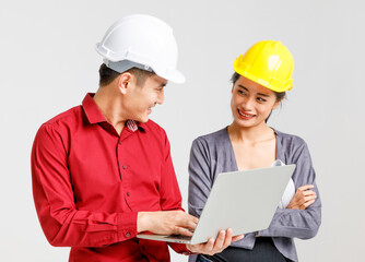 Smiling builders working on project together in studio