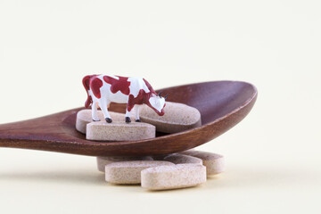 Drug supplement calcium tablets and a cow model