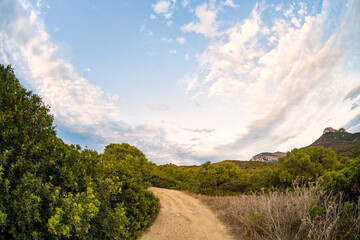 Stunning view a trail leading to Capo Figari. Capo Figari is a limestone promontory located in...