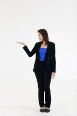 Beautiful middle aged Asian woman wearing black trousers and jacket posing in manner for advertising