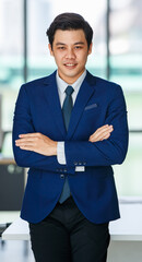 Fototapeta premium Smiling ethnic businessman in office