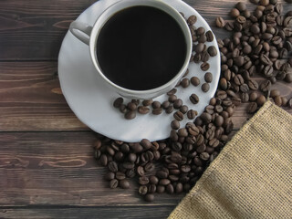 a cup of coffee and grains on the table