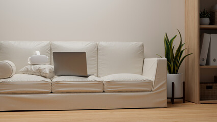 Comfortable living room with comfy white sofa, laptop and vr glasses on top
