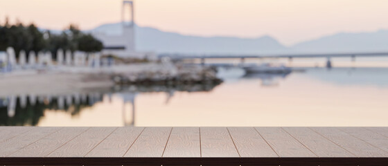 Empty of wood table top for product display with blurred  lake harbour view in the background