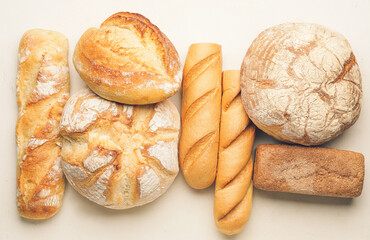 Assortment of fresh bread on light background