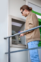 Man withdrawing money from ATM